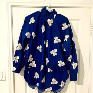 Vintage oversized button down shirt with white bow graphic.